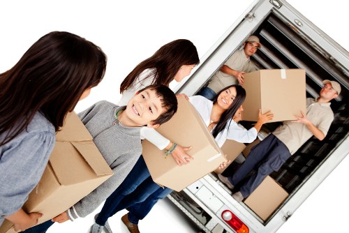 Man with van in Barbican loading items for a transparent quote-based move