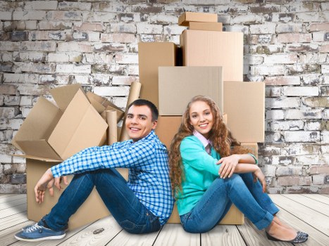 Professional movers loading items near Barbican residential buildings