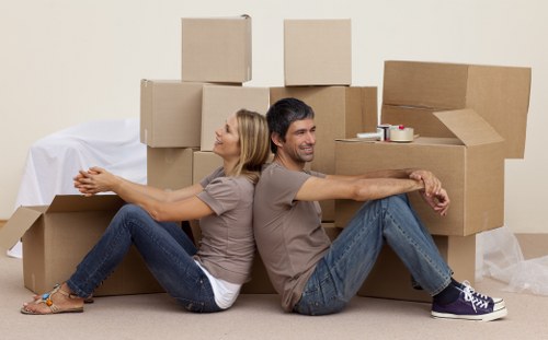 Local moving team handling boxes and furniture in Barbican