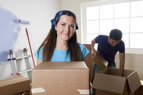 A professional moving crew loading items for a Barbican move