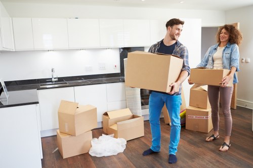 Removal team navigating access challenges in a Barbican residential block