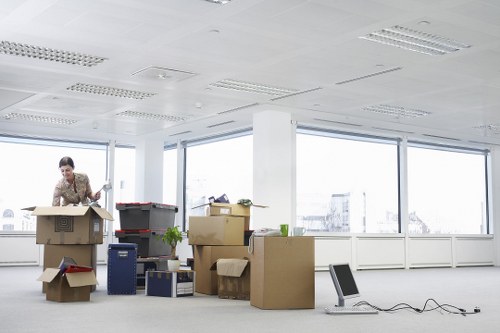 Unloading boxes into a new Barbican home with care and organisation